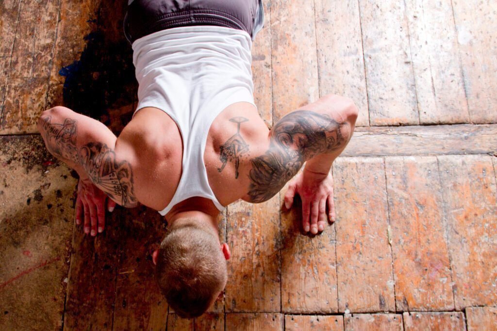 Young man doing press ups, overhead view